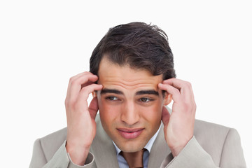 Close up of salesman having a headache