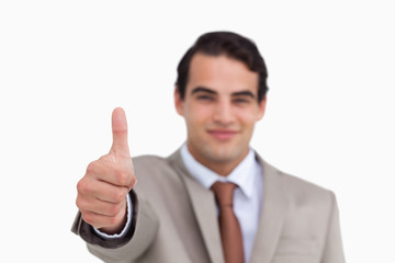 Close up of thumb up being given by salesman