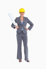 Smiling female architect with plans and helmet on