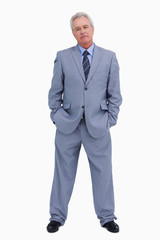 Mature tradesman with hands in his pockets
