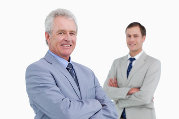 Smiling tradesmen with arms folded