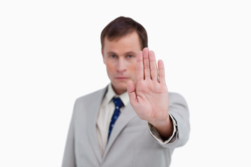 Close up of businessman's palm signalizing stop