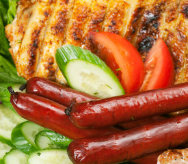 Grilled sausage with sauce and vegetables