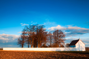 Lonely cemetery in the autumn field