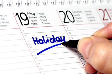 Kalender mit Eintrag Holiday