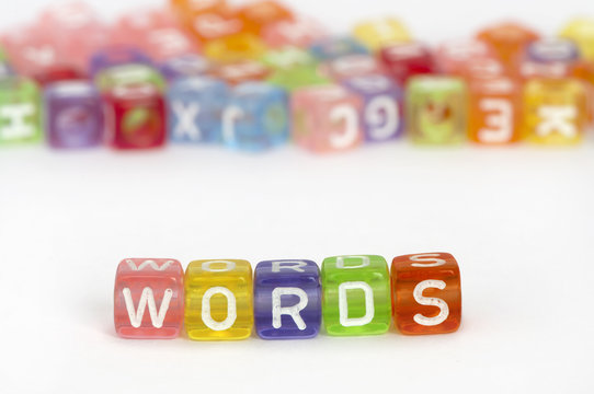Text Words on colorful cubes over white