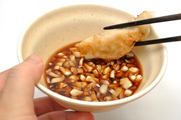 Eating fired chinese dumpling