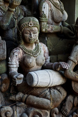 Fototapeta na wymiar Statue of woman beating drum.