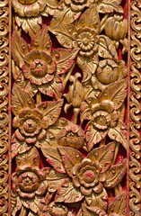 Traditional Thai style on temple door in Thailand