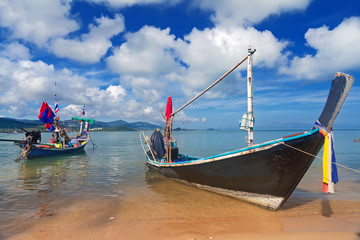 Long thai boat on sand beach