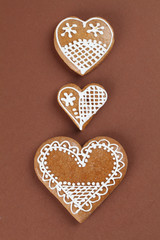 Gingerbread hearts on brown background