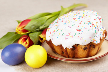 Easter cakes, painted eggs and tulips