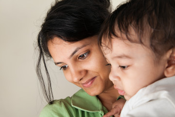 Indian mother and baby smiling