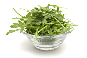 fresh rucola leafs in a glass bowl