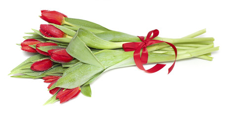 red tulips tied with a red ribbon