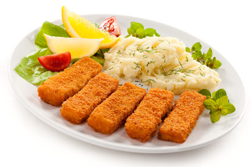 Fried fish fingers, mashed potatoes and vegetables