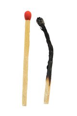 Close-up of a burnt match and a whole red match