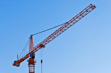 Yellow crane against blue sky