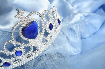 Toy tiara with diamonds and blue gem, like a princess crown