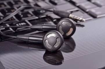 Headset  phone on  notebook .Conception of workplace