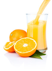 Fresh Oranges Juice Pouring into a Glass Isolated on white backg