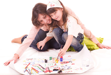 mother and her little daughter with color paint