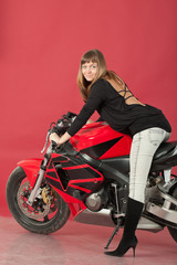 Plakat Young girl with bike, on red background