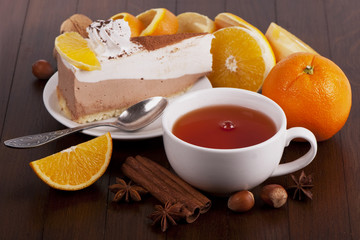 Air vials, white cup of tea, orange, cinnamon and anise