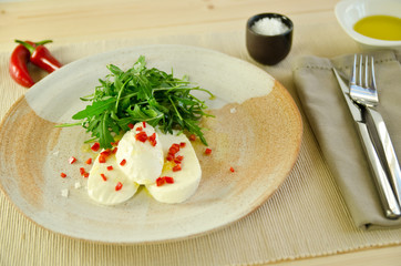 mozzarella with chili oil and rocket