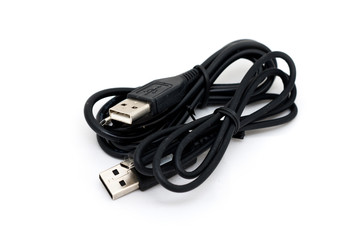 Usb cable with mini-usb laying on a white background