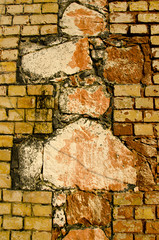 Interesting architecture wall of bricks cross sign
