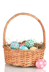 Fototapeta na wymiar Colorful Easter eggs in the basket isolated on white
