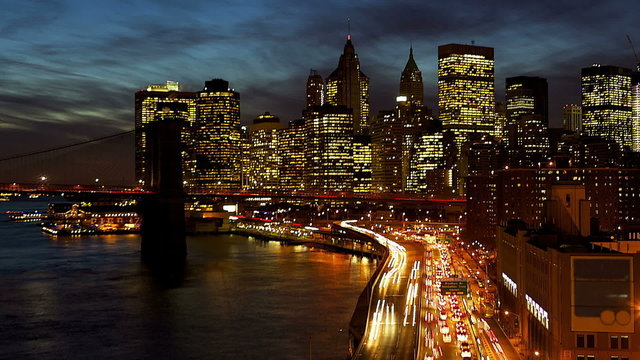 New York City Manhattan with Brooklyn Bridge at dusk time lapse