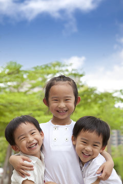 three happy asian kids