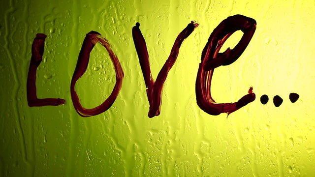 The inscription "love" watches off on a yellow background