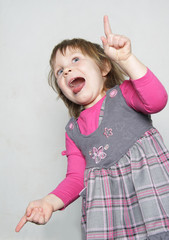 studio shot of young girl making faces