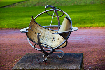 sundial. old sun clock dial in a garden