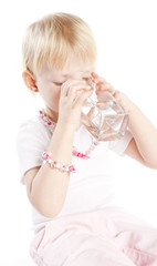 portrait of little girl drinking water