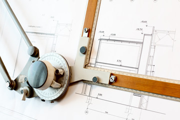 Old-fashioned drawing board with white project blueprint