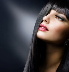 Fashion Brunette. Beautiful Makeup and Healthy Black Hair