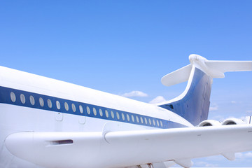 close up of windows and tail fin of a big airbus airplane - obrazy, fototapety, plakaty