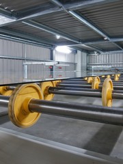 Large sheets of glass on rollers..