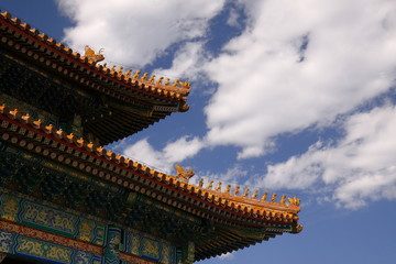 Fototapeta na wymiar Forbidden City under blue sky and white clouds