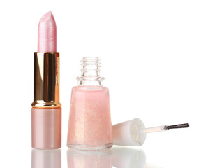 Pink lipstick and beige nail polish with sparkles isolated