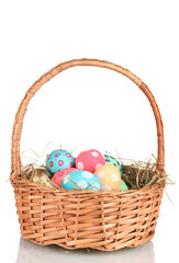 Fototapeta na wymiar Colorful Easter eggs in the basket isolated on white
