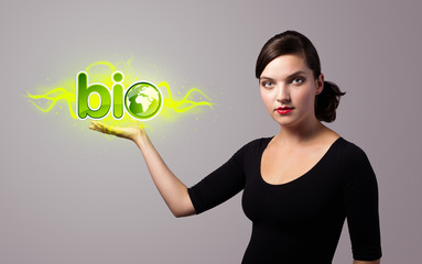 woman holding virtual eco sign