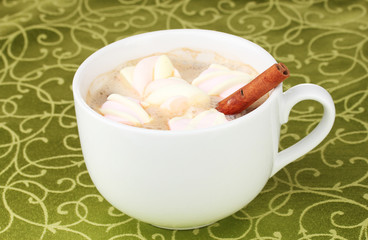 Cup of cappucino with marshmallows and cinnamon