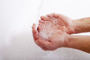 Hands and water.