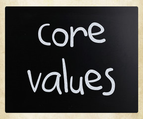 Ethics concept - core values handwritten with white chalk on a b