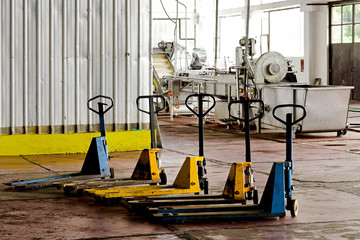 Five manual forklifts